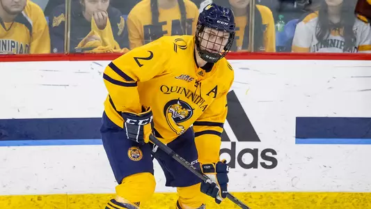 Karlis Cukste Looking to Pass Puck vs. Yale