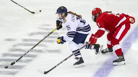 Laura Lundblad skates past a SHU defender