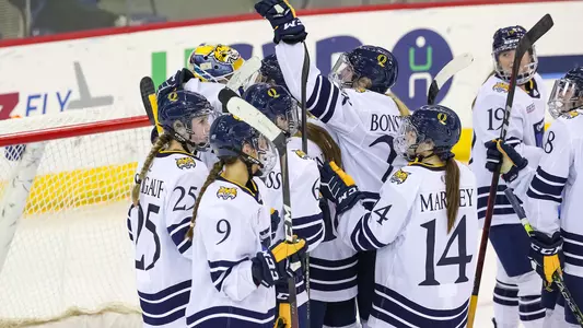 Team huddles after win