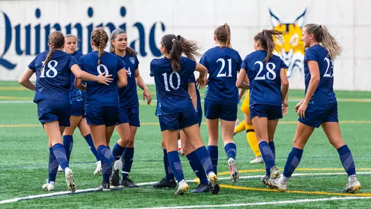Women's soccer celebrates after goal