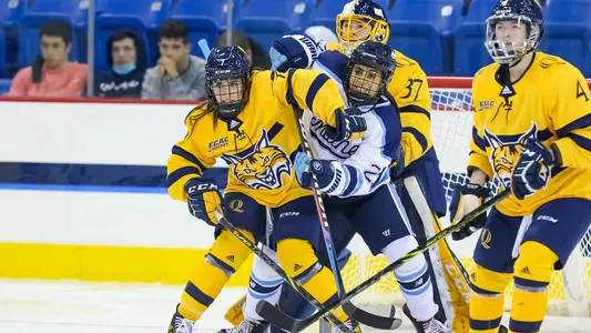 Maddy Samoskevich fights off Maine player