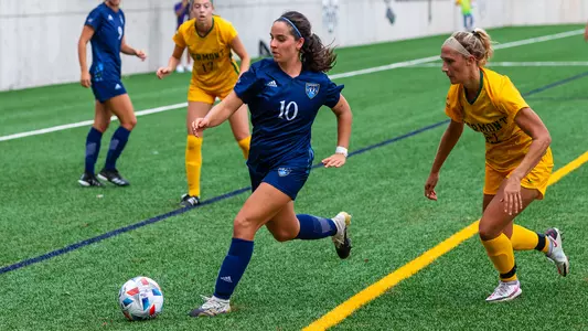 Selena Salas takes the ball past a defender