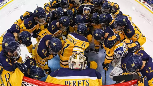 Team Huddle around Perets before North Dakota
