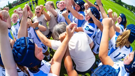 Rugby Team Huddles Before game