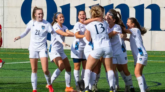 Women's soccer celebrates after a game-winning goal