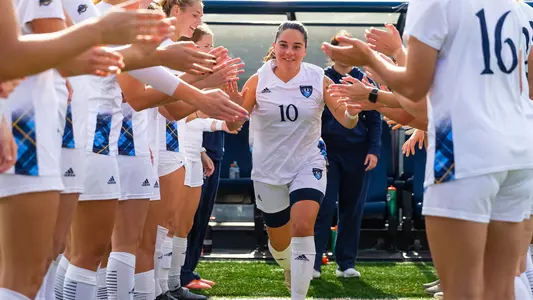 Selena Salas runs through high five line