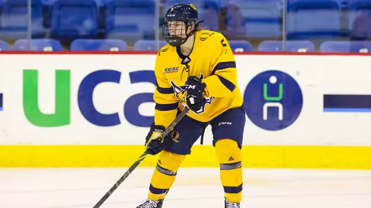 Kate Reilly scans the ice