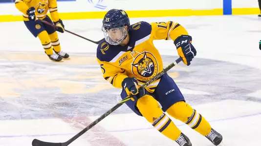 Jayden Lee Carries Puck Against North Dakota