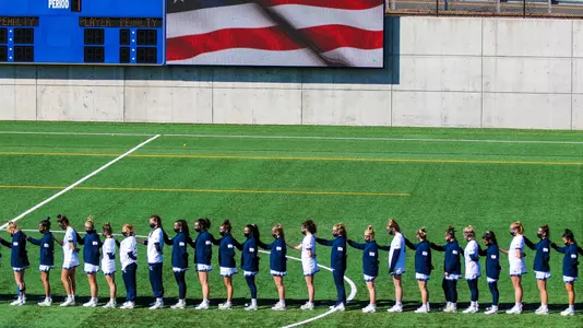 Women's Lacrosse Stands for Anthem