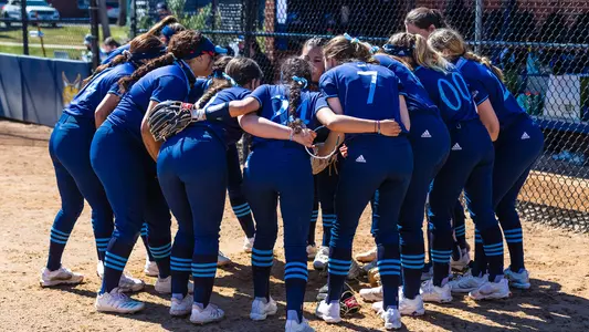 Softball team huddles before game