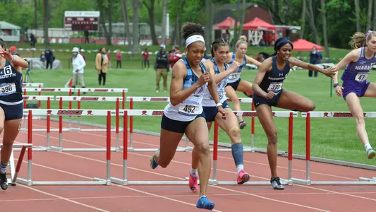 Symone Foster, Kalli'ana Botelho run in the 60m hurdles