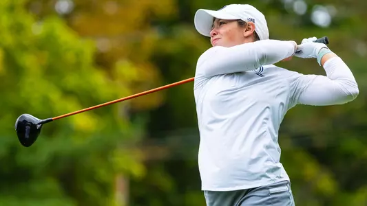 Mia Grzywinski tees off at the QU Classic