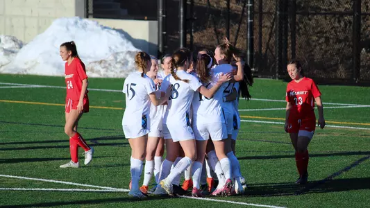 Women's soccer celebrates after goal