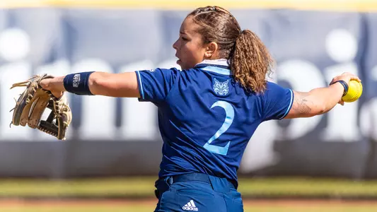 Kayla Jensen throws during warm ups vs Monmouth