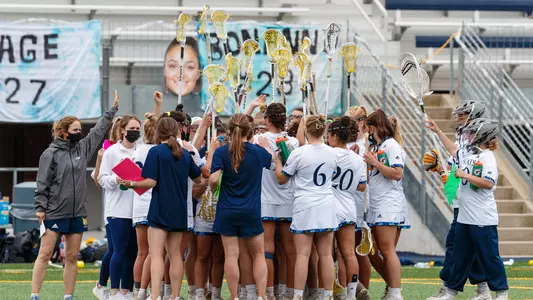Women's Lacrosse Huddles During a Time Out vs. Manhattan