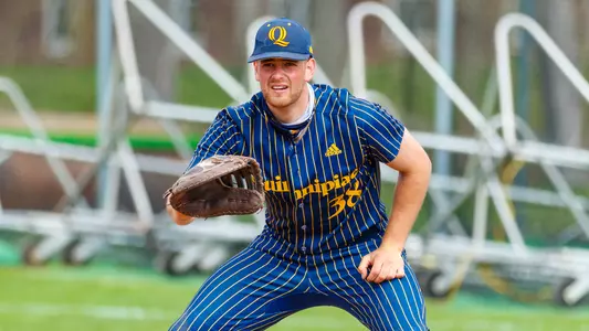 Michael Kohn Holds the Runner on First vs. Siena