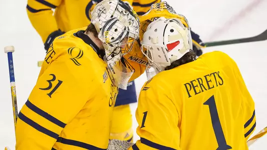 Yaniv Perets Huddles with Keith Petruzzelli Before Game