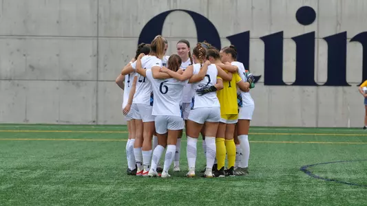 Team huddles before kickoff