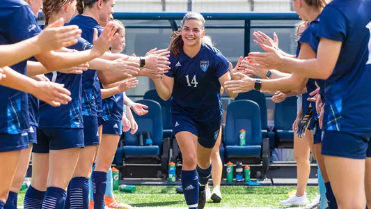 Lauren Triglione runs through starters line