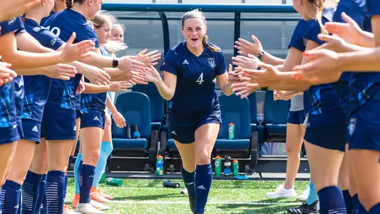 Emily Loney runs through starters tunnel