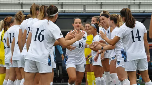 Selena Salas high fives teammates