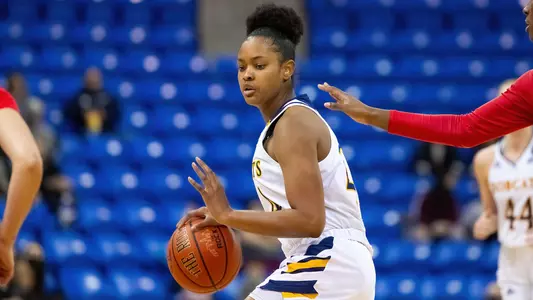 Amani Free attacks the basket