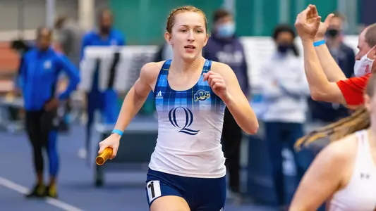 Asia Mercier runs in the 4x400m relay
