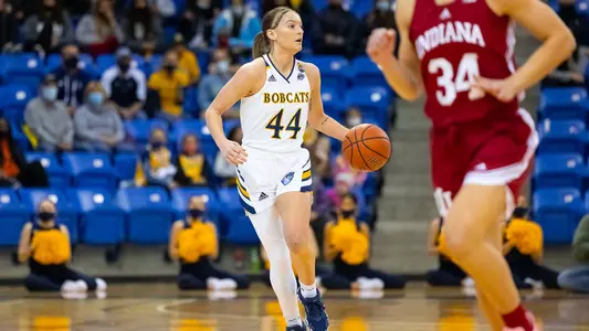 Makenzie Helms dribbles the ball up the floor