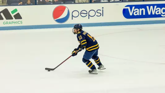 Jacob Nordqvist takes the puck up the ice at Maine