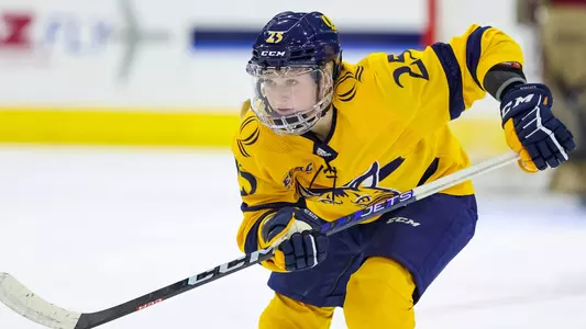 Nina Steigauf chases the puck against Boston College