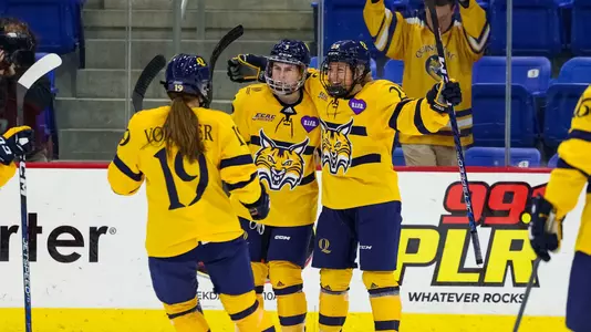 Bobcats celebrate scoring a goal against Cornell