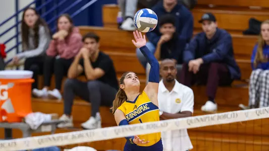 Aryanah Diaz rises for an attack attempt at the net