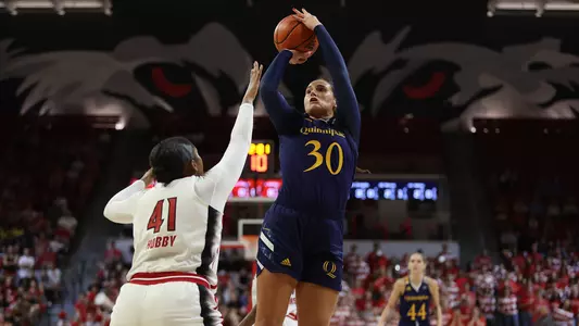 Mikala Morris takes a jumper over an NC State defender