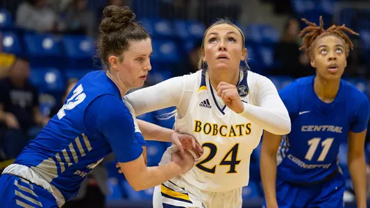 Rose Caverly boxes out for a rebound