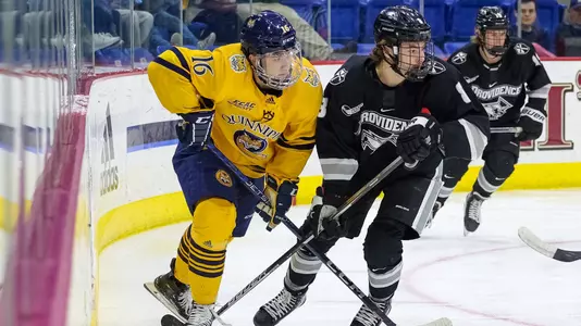 Jacob Quillan controls the puck against Providence