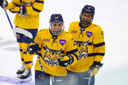 Maya Labad and Alexa Hoskin celebrate after beating Cornell