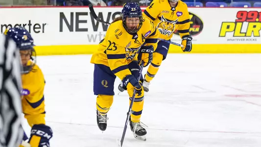 Sadie Peart skates with the puck against Cornell