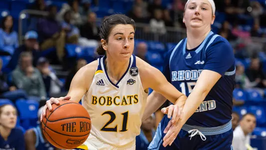 Jackie Grisdale drives her defender vs. URI