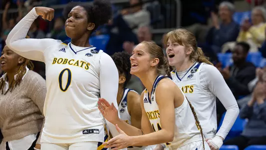 WBB bench celebrates a score