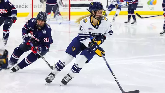 Olivia Mobley skates with the puck against UCONN