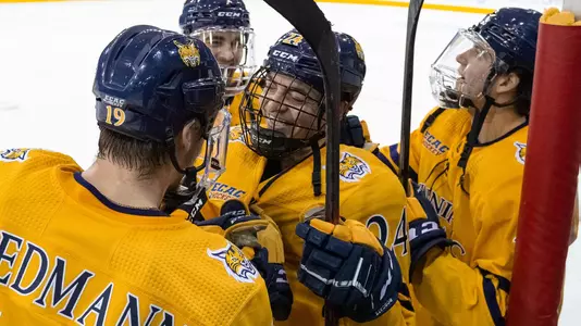 Brendan Less Mobbed by Teammates after goal against Dartmtouth
