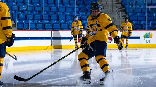 Lexie Adzija skates during starting line ups