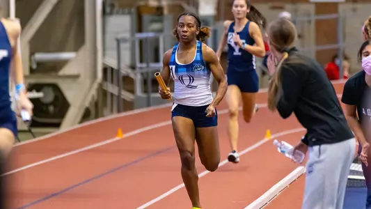 Aisha Gay competes in a relay event at Yale