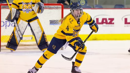 Kendall Cooper scans ice as the Bobcats transition to the offensive zone