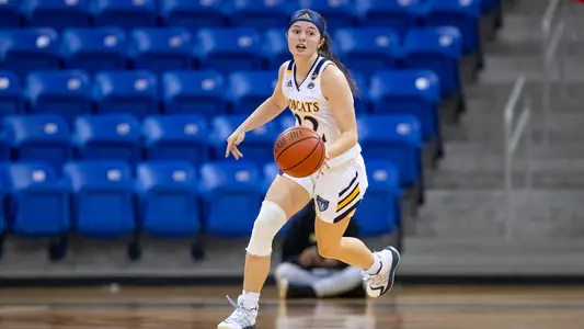 Mackenzie DeWees dribbles up the floor