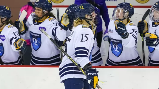 Olivia Mobley skates through high five line after scoring