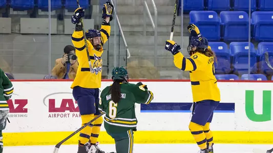 Mobley, Hoskin celebrate a goal against Clarkson