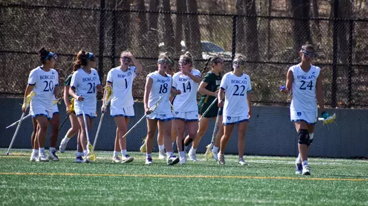 Women's Lacrosse Team walks upfield during game