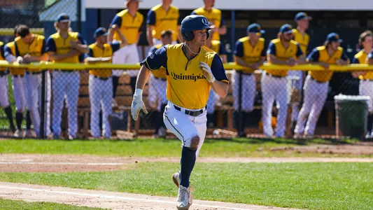 Ian Ostberg runs to first