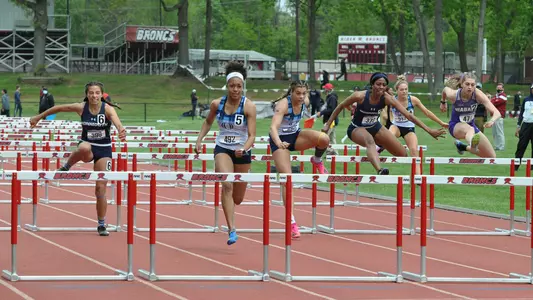 Symone Foster, Kalli'ana Botelho race in the 100m hurdles